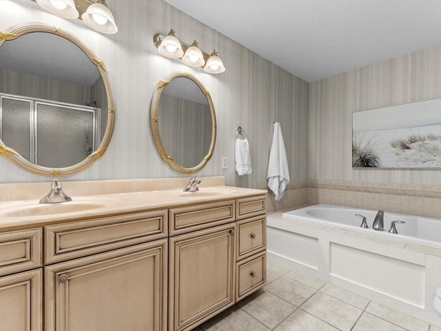 bathroom featuring wallpapered walls, a shower stall, double vanity, a bath, and tile patterned flooring