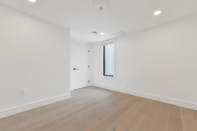 50 Leo M Birmingham Pkwy Unit 509, Boston, MA 02135 - unfurnished room with baseboards, light wood-style flooring, and recessed lighting