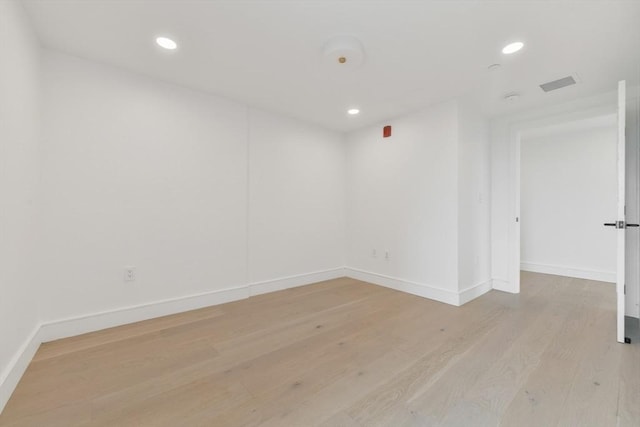 50 Leo M Birmingham Pkwy Unit 509, Boston, MA 02135 - empty room featuring light wood-type flooring, baseboards, and recessed lighting