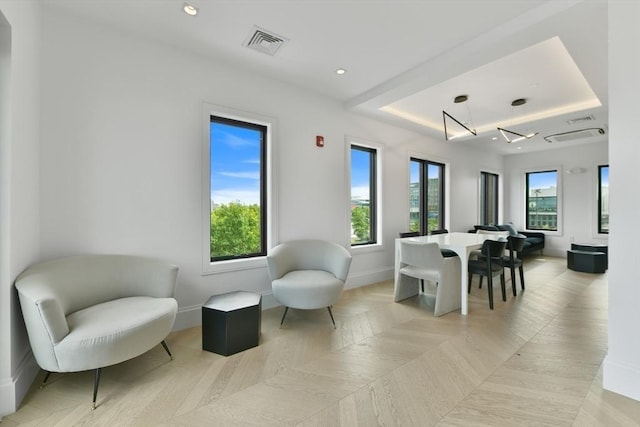 50 Leo M Birmingham Pkwy Unit 509, Boston, MA 02135 - dining space featuring a tray ceiling, plenty of natural light, baseboards, and recessed lighting