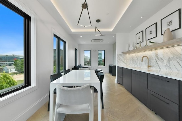 50 Leo M Birmingham Pkwy Unit 509, Boston, MA 02135 - dining space with a raised ceiling, wet bar, baseboards, and recessed lighting