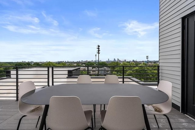50 Leo M Birmingham Pkwy Unit 509, Boston, MA 02135 - view of patio featuring outdoor dining area and a balcony