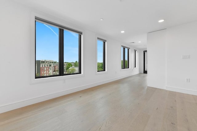 50 Leo M Birmingham Pkwy Unit 509, Boston, MA 02135 - spare room featuring light wood-style floors, recessed lighting, and baseboards