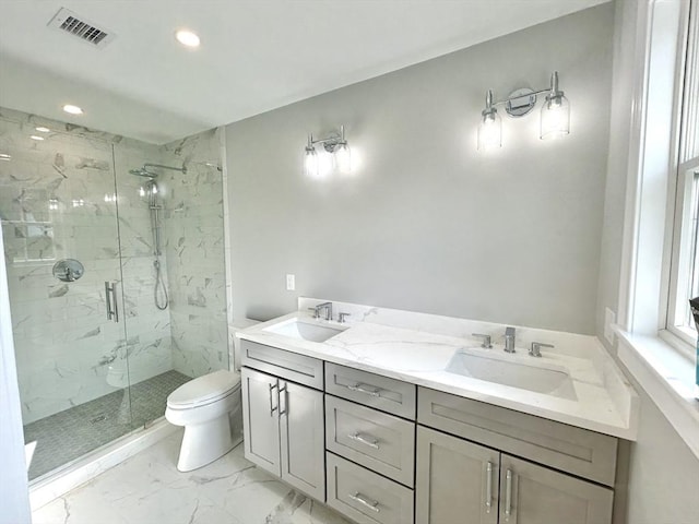 50 York Ave Unit 50, Watertown, MA 02472 - full bathroom featuring a marble finish shower, recessed lighting, marble look tile flooring, and double vanity