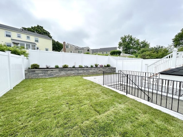 50 York Ave Unit 50, Watertown, MA 02472 - fenced backyard featuring a patio and a residential view