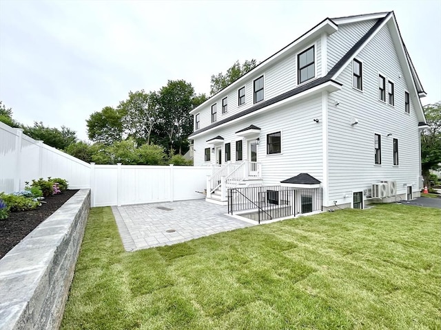 50 York Ave Unit 50, Watertown, MA 02472 - back of property featuring a fenced backyard and a patio