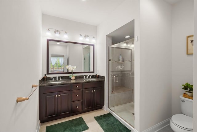 12 Bowood Ln Unit 36, Marlborough, MA 01752 - bathroom with a shower stall, toilet, double vanity, tile patterned flooring, and baseboards