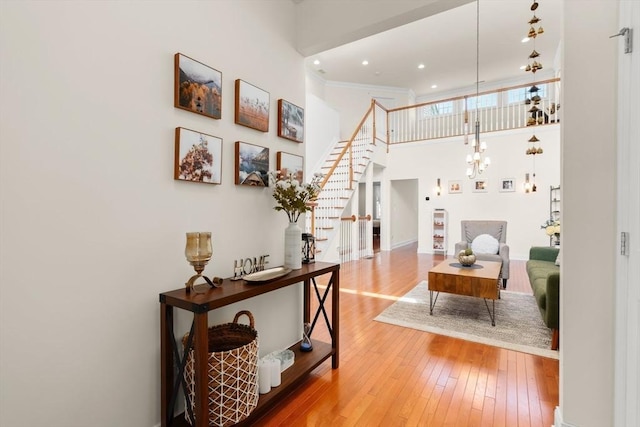 12 Bowood Ln Unit 36, Marlborough, MA 01752 - corridor with hardwood / wood-style floors, stairway, a towering ceiling, and recessed lighting