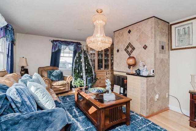 living room with hardwood / wood-style floors and a notable chandelier