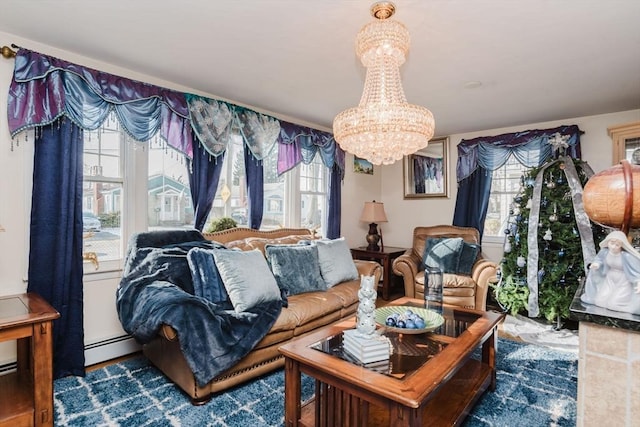 living room with a baseboard radiator and a chandelier