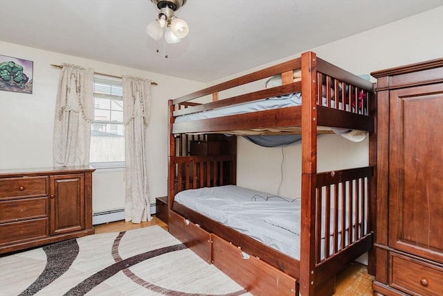 bedroom with a baseboard radiator