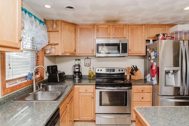 kitchen with sink, stainless steel appliances, and light brown cabinets