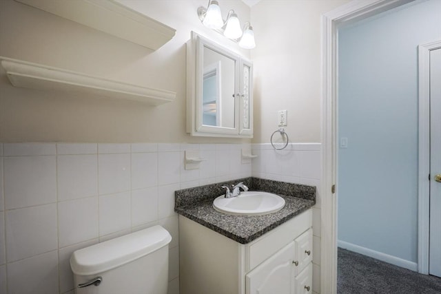 3 Dailey St Unit I, Attleboro, MA 02703 - bathroom featuring vanity, toilet, and tile walls