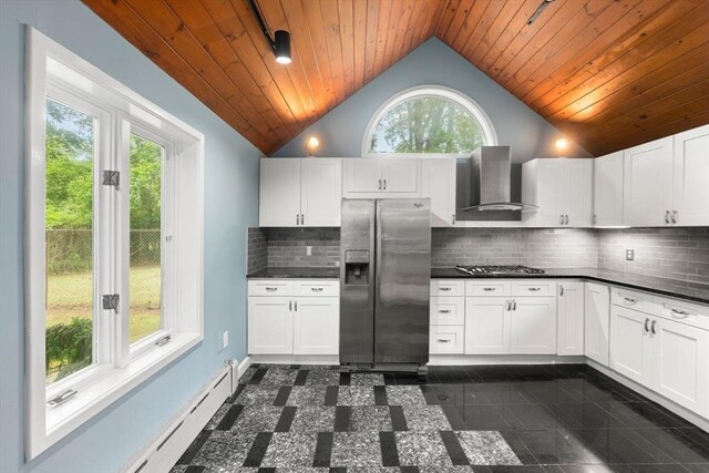 220 Prospect St, Seekonk, MA 02771 - kitchen featuring stainless steel appliances, wall chimney range hood, vaulted ceiling, dark countertops, and wooden ceiling