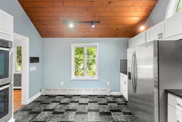 220 Prospect St, Seekonk, MA 02771 - kitchen with stainless steel appliances, lofted ceiling, wood ceiling, baseboard heating, and white cabinets