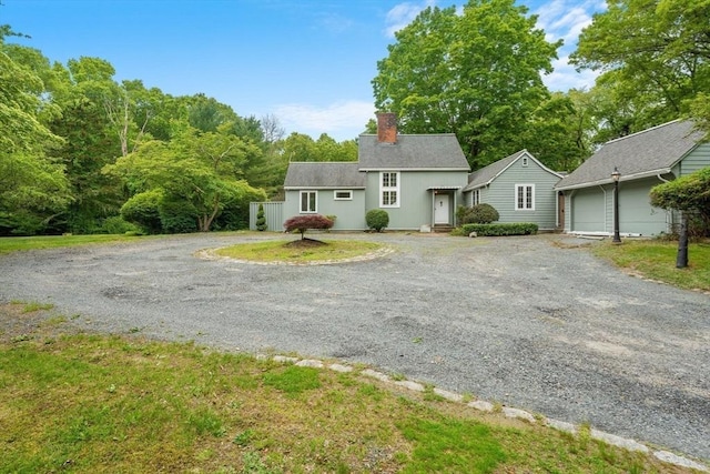 220 Prospect St, Seekonk, MA 02771 - view of front of home with a chimney, a garage, and driveway