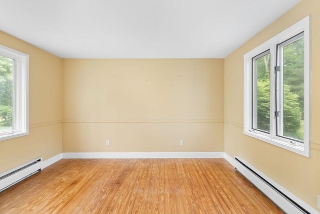 220 Prospect St, Seekonk, MA 02771 - empty room featuring baseboard heating, light wood-style floors, and baseboards