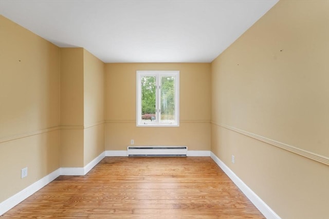 220 Prospect St, Seekonk, MA 02771 - spare room with a baseboard heating unit, wood finished floors, and baseboards