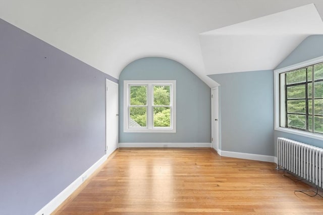 220 Prospect St, Seekonk, MA 02771 - additional living space featuring radiator heating unit, lofted ceiling, light wood-style floors, and baseboards