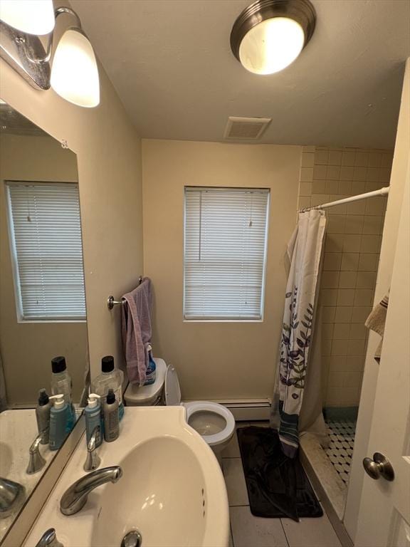 full bath featuring tile patterned floors, visible vents, a stall shower, and a sink