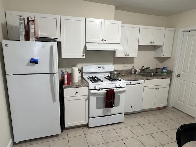 kitchen featuring white appliances, light tile patterned flooring, a sink, white cabinets, and under cabinet range hood