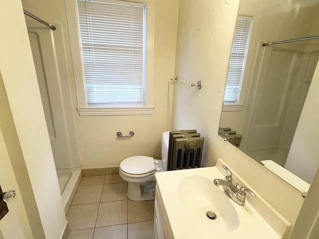 full bath featuring vanity, tile patterned flooring, and a walk in shower