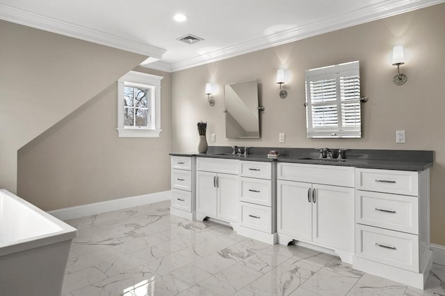 bathroom with plenty of natural light, ornamental molding, and vanity