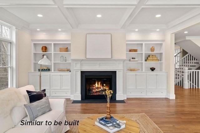 living room featuring beamed ceiling, light hardwood / wood-style flooring, and coffered ceiling