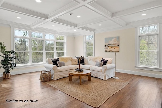 living room featuring beamed ceiling, light hardwood / wood-style floors, and coffered ceiling