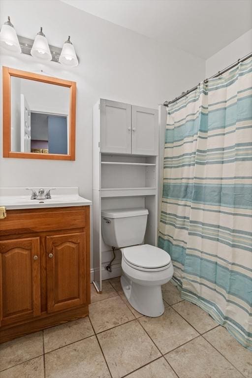 bathroom with a shower with shower curtain, toilet, vanity, and tile patterned flooring