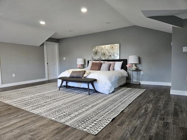 bedroom featuring lofted ceiling and dark hardwood / wood-style flooring