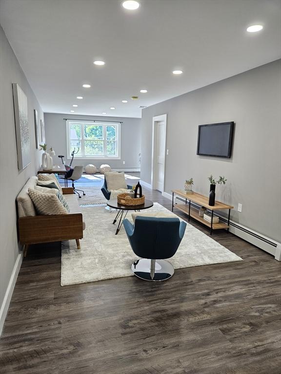 living room with dark wood-type flooring