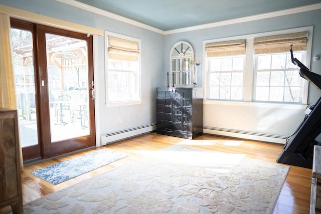 foyer featuring crown molding, wood finished floors, and a baseboard radiator