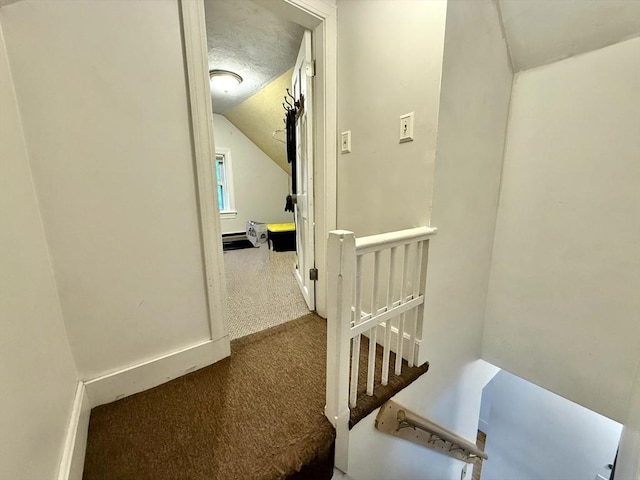 262 Adams St, Newton, MA 02458 - hallway with carpet flooring, lofted ceiling, baseboards, and an upstairs landing