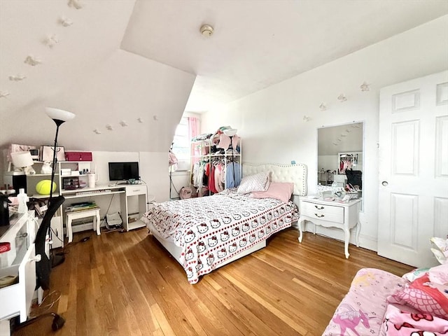 262 Adams St, Newton, MA 02458 - bedroom with wood finished floors and vaulted ceiling