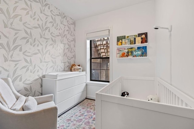 interior space featuring wallpapered walls and a bath