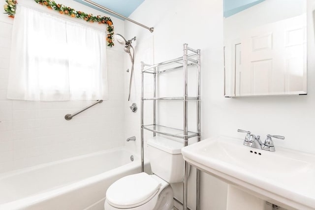 full bathroom featuring toilet, a sink, and bathing tub / shower combination