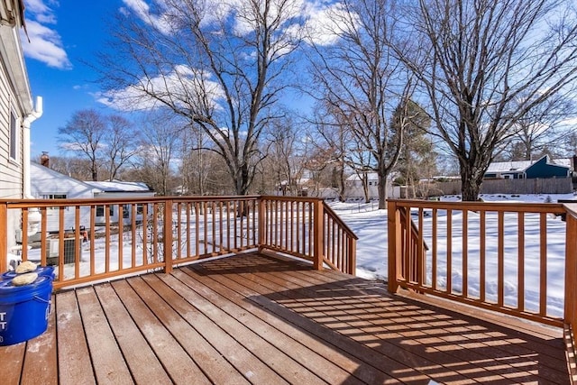 snow covered deck with fence