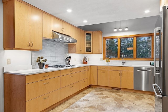 kitchen featuring light brown cabinetry, sink, appliances with stainless steel finishes, and tasteful backsplash