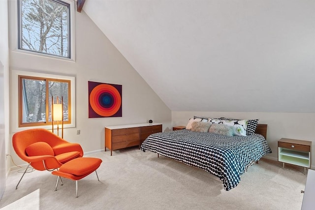 carpeted bedroom featuring vaulted ceiling with beams