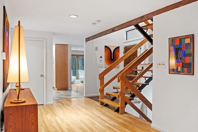 staircase featuring hardwood / wood-style floors