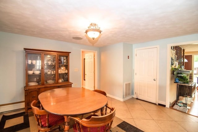 95 N Lowell St, Methuen, MA 01844 - dining area featuring light tile patterned floors and baseboard heating