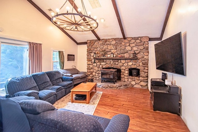 95 N Lowell St, Methuen, MA 01844 - living room with a chandelier, a wood stove, hardwood / wood-style floors, beam ceiling, and high vaulted ceiling