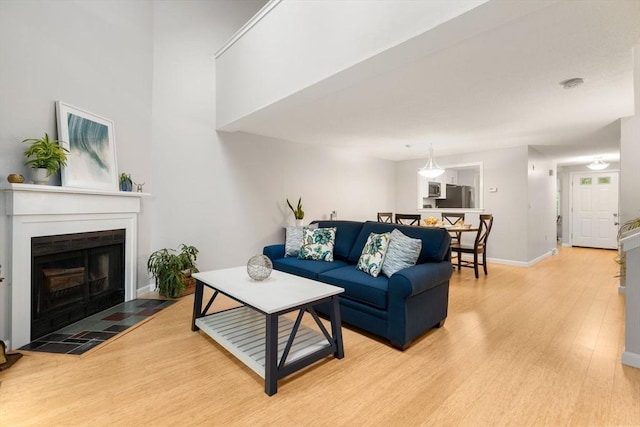 20 Hawthorne Vlg Unit C, Franklin, MA 02038 - living room featuring light wood finished floors and a tile fireplace