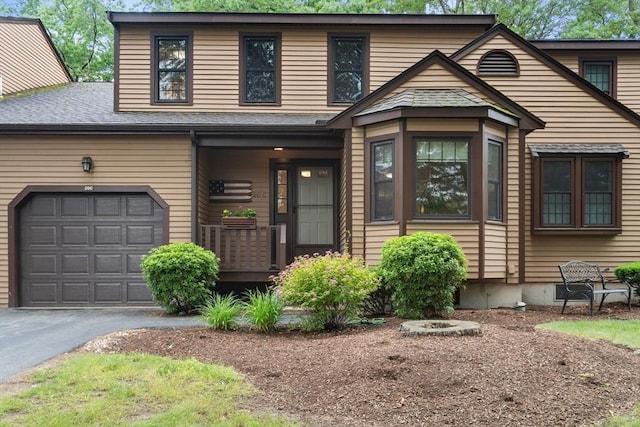 20 Hawthorne Vlg Unit C, Franklin, MA 02038 - view of front facade featuring driveway, covered porch, and a shingled roof