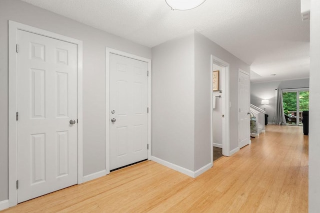 20 Hawthorne Vlg Unit C, Franklin, MA 02038 - foyer entrance with light wood-style flooring and a textured ceiling