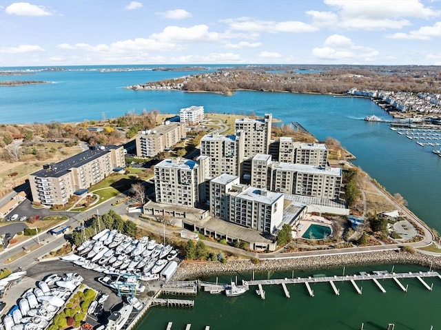 birds eye view of property featuring a city view and a water view