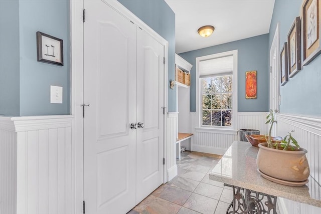 interior space featuring a wainscoted wall