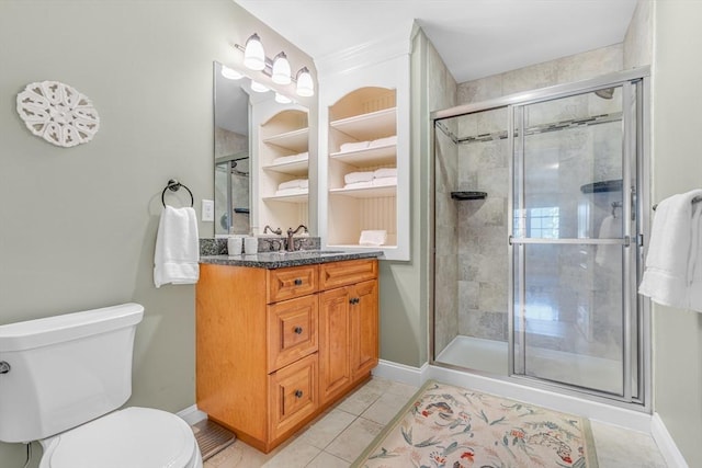 full bathroom with tile patterned flooring, vanity, toilet, baseboards, and a stall shower
