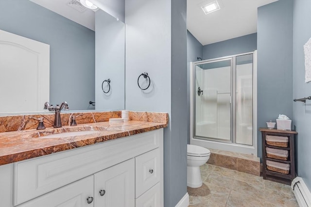 bathroom with vanity, baseboard heating, a shower stall, and toilet